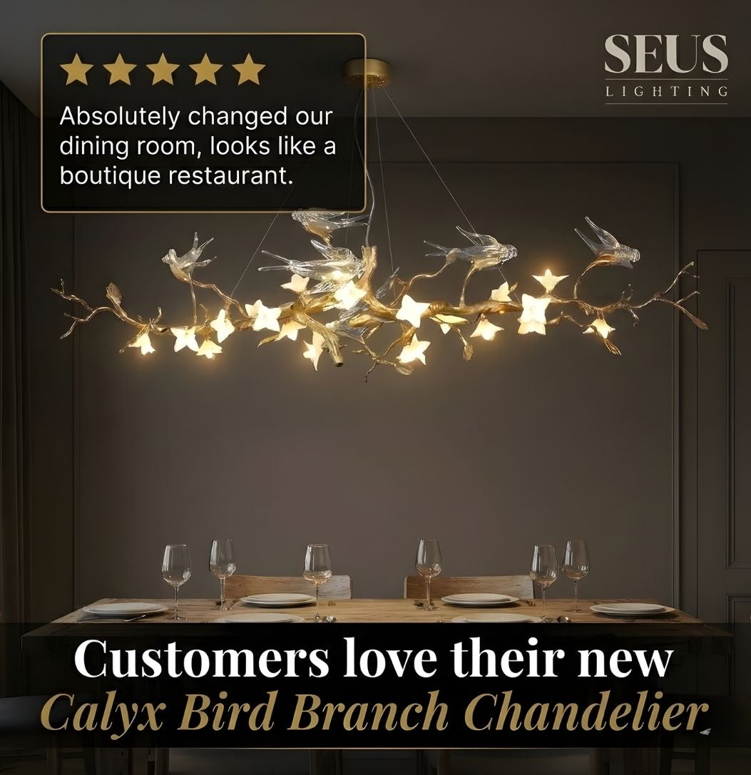 Calyx Bird Branch Chandelier in a dining room setting with SEUS Lighting branding.