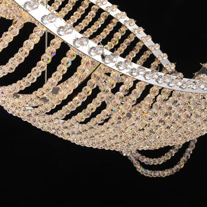 Modern Wave Crystal Chandelier Over Dining Table  Seus Lighting