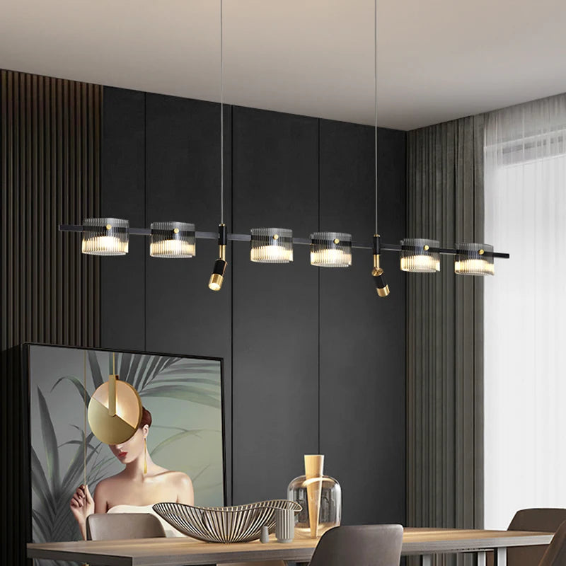 Peli Modern Linear Kitchen Island Chandelier in black and gold finish over a kitchen island